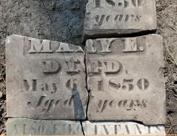 Piecing together a grave stone for the Mudd family – Photo by Jerry Prouhet
